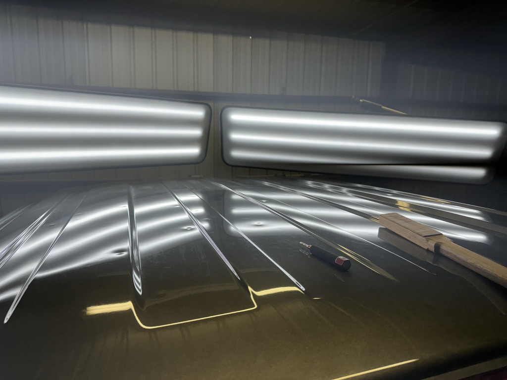 Hail-damaged roof mapped beneath two PDR reflection lights
