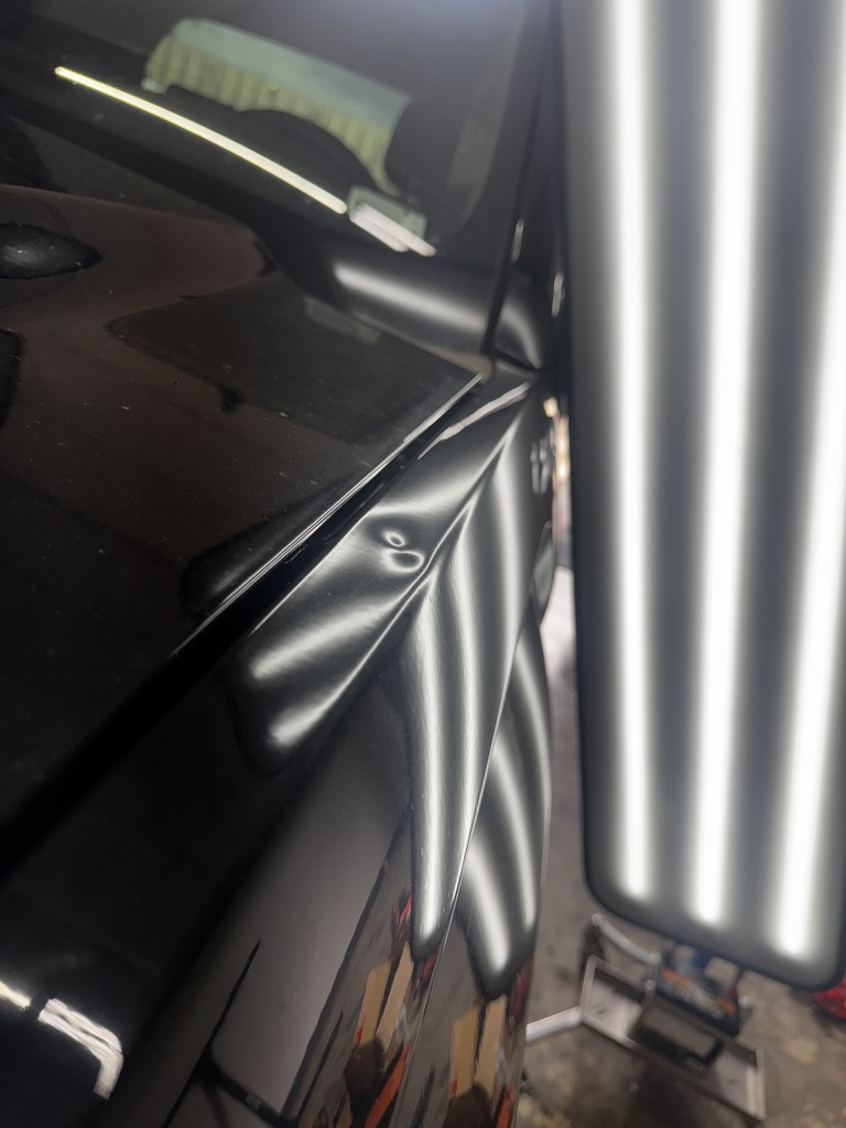 Sharp body-line dent illuminated for paintless repair